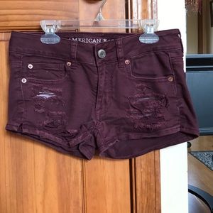 Burgundy ripped denim shorts